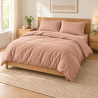Peach embossed microfiber bed sheet set with duvet cover, fitted sheet, and matching pillowcases