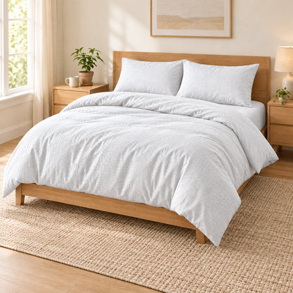 White embossed microfiber bed sheet set with duvet cover, fitted sheet, and matching pillowcases